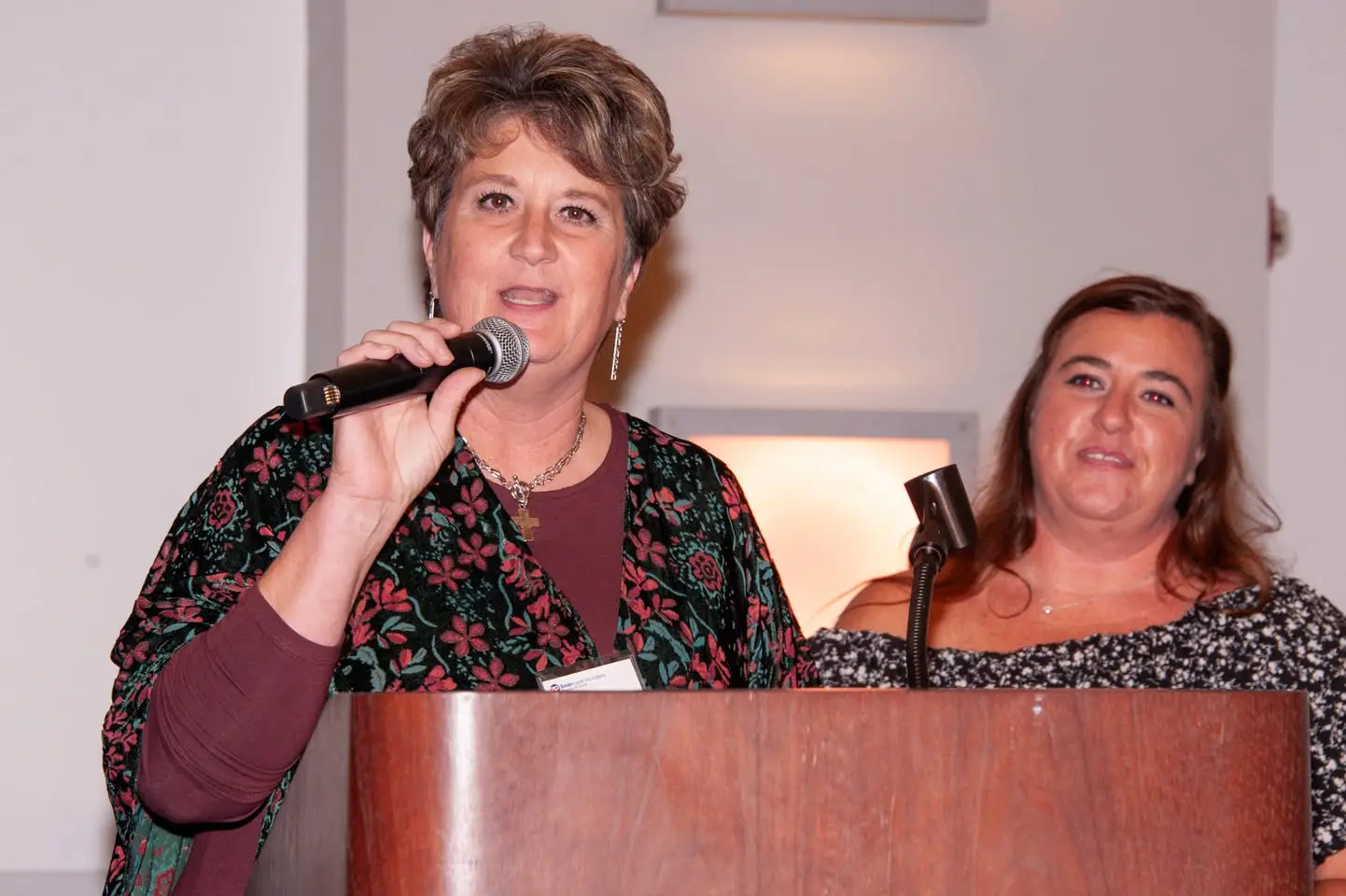 Beth Habbyshaw and Christina Sowa, HS Transition Coordinators, speak on a podium at the Heinz History Center in Pittsburgh, PA